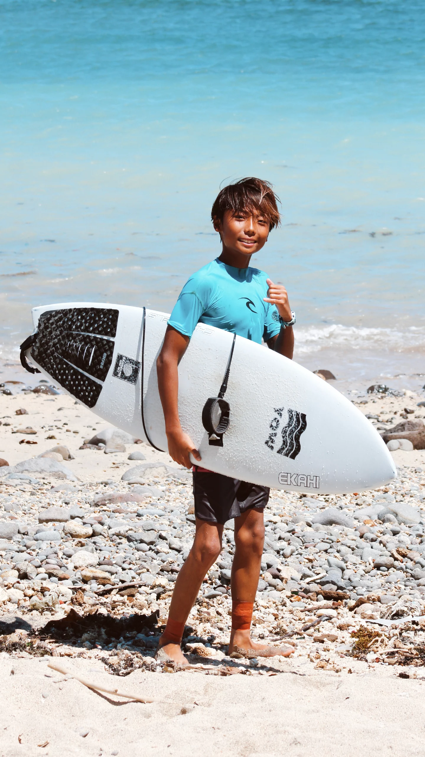 Carbon surfboard channels with the Grom traction pad