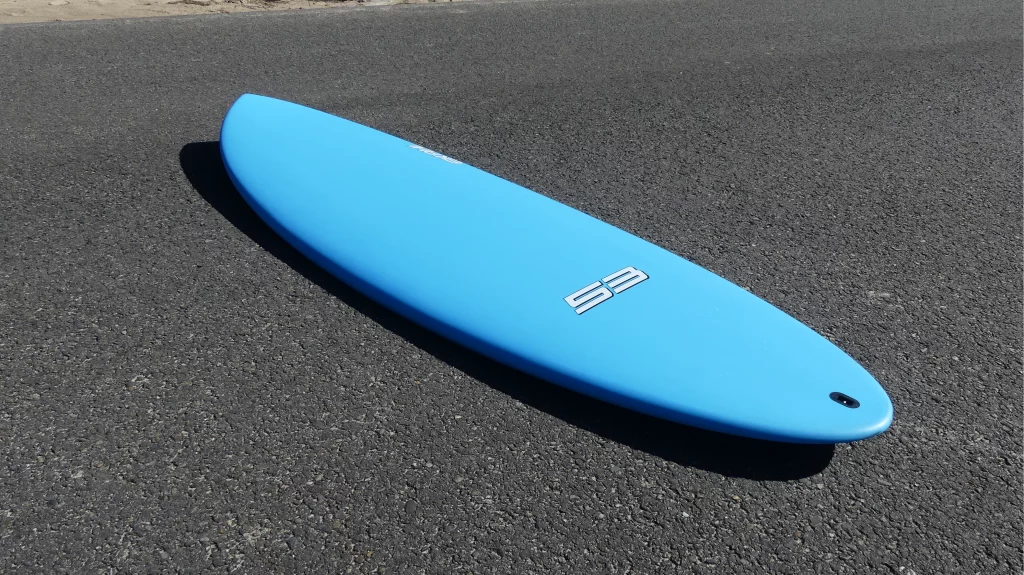 Ekahi 53 Bitume carbon surfboard, blue deck, top deck view