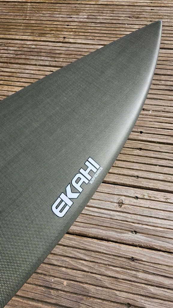 Top view of a ekahi carbon kevlar Channels carbon surfboard 5'8.