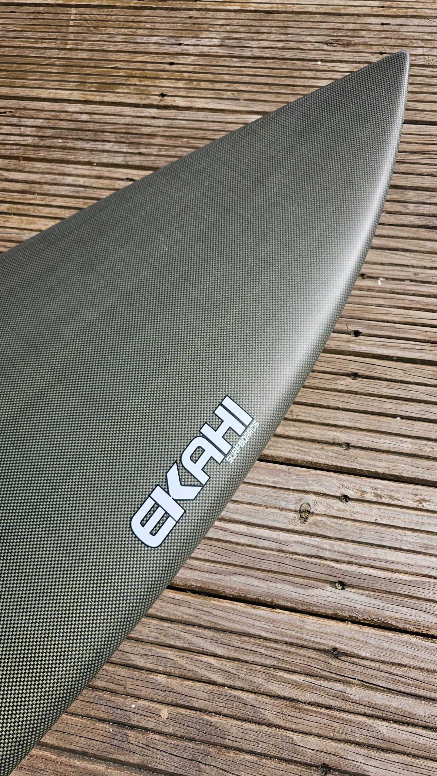 Top view of a ekahi carbon kevlar Channels carbon surfboard 5'8.