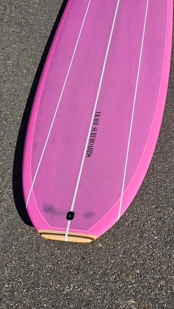 Ekahi Single Bitume carbon surfboard, pink deck, top deck view