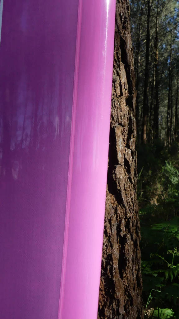Ekahi Single Bois carbon surfboard, pink deck, bottom view