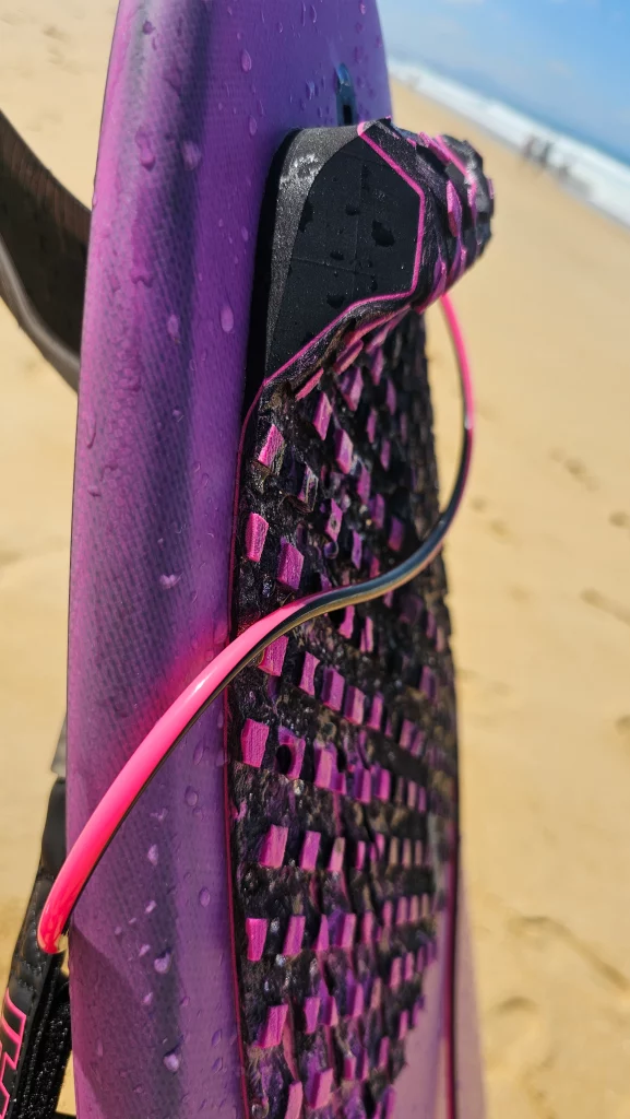 EKAHI traction pad and leash on a carbon surfboard
