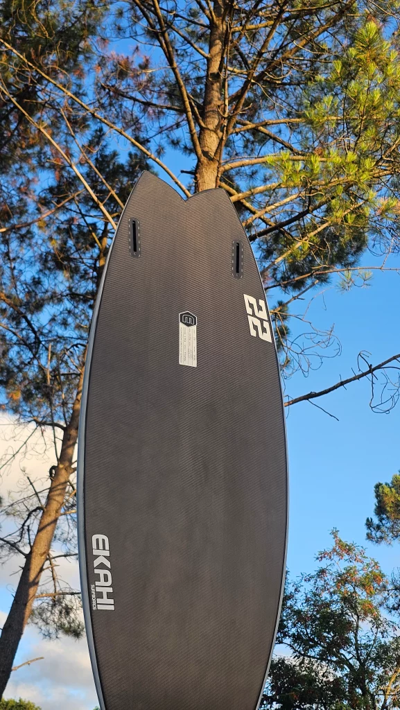 Ekahi 22 carbon surfboard, white deck, bottom view