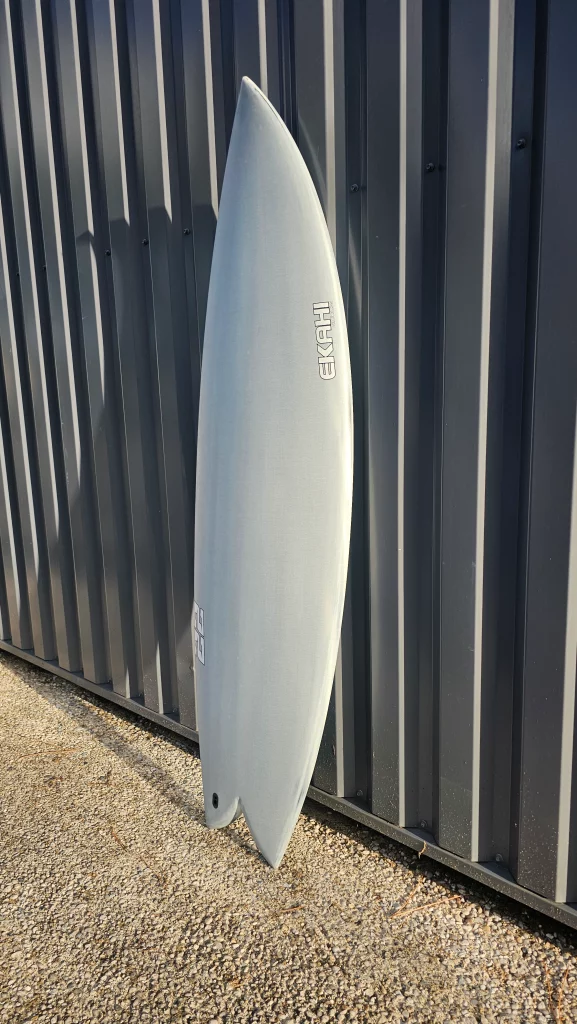 Ekahi 22 carbon surfboard, white deck, top deck view