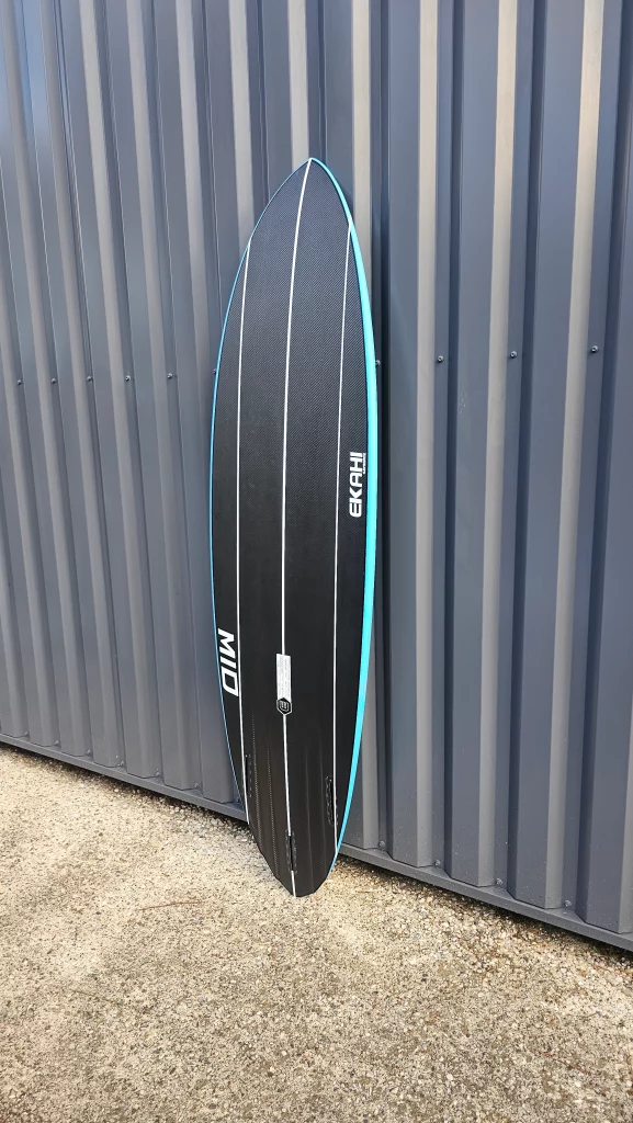 Ekahi Mid carbon surfboard, blue deck, bottom view