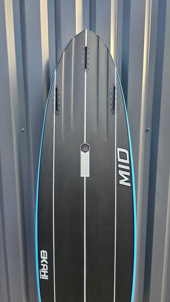 Ekahi Mid carbon surfboard, blue deck, bottom view