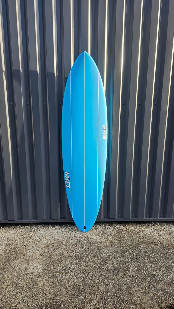 Ekahi Mid carbon surfboard, blue deck, top deck view