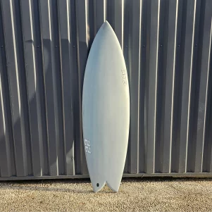 Top and bottom view of Ekahi white 22 surfboard, a twin fin carbon fish, available in 5’9 and 5'11.