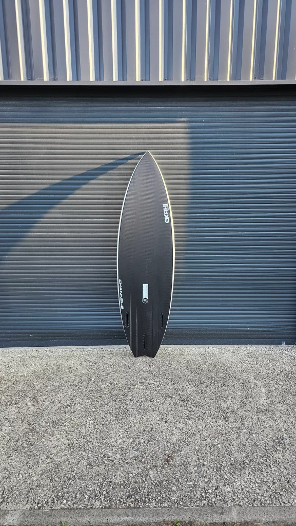 Ekahi Channels carbon surfboard, white deck, bottom view