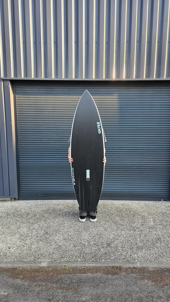 Ekahi Channels carbon surfboard, white deck, bottom view