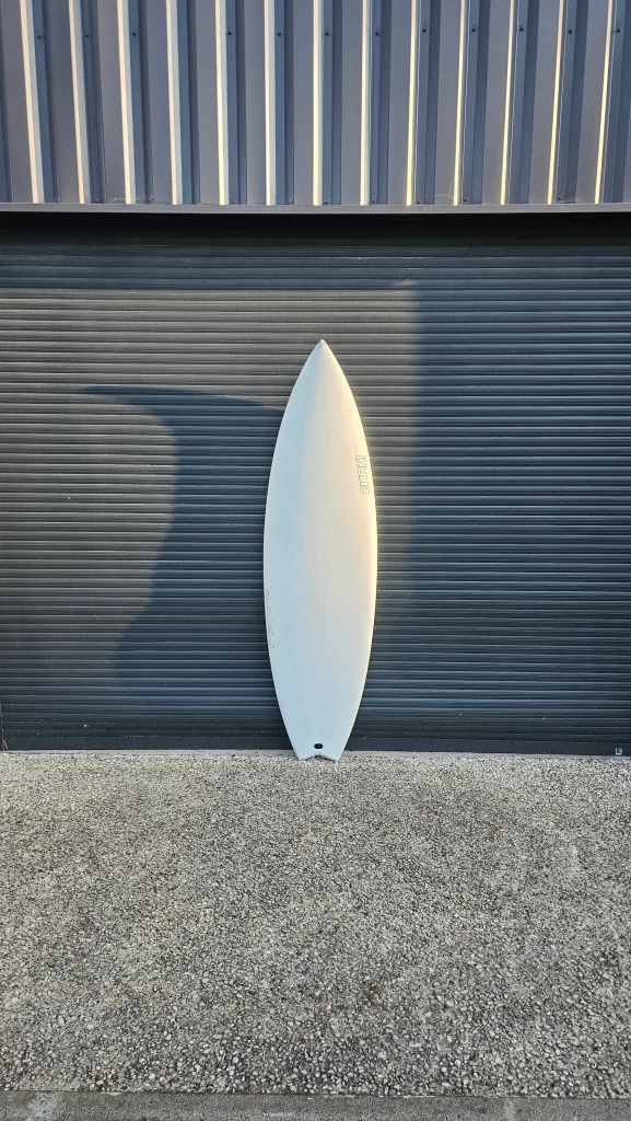 Ekahi Channels carbon surfboard, white deck, top deck view