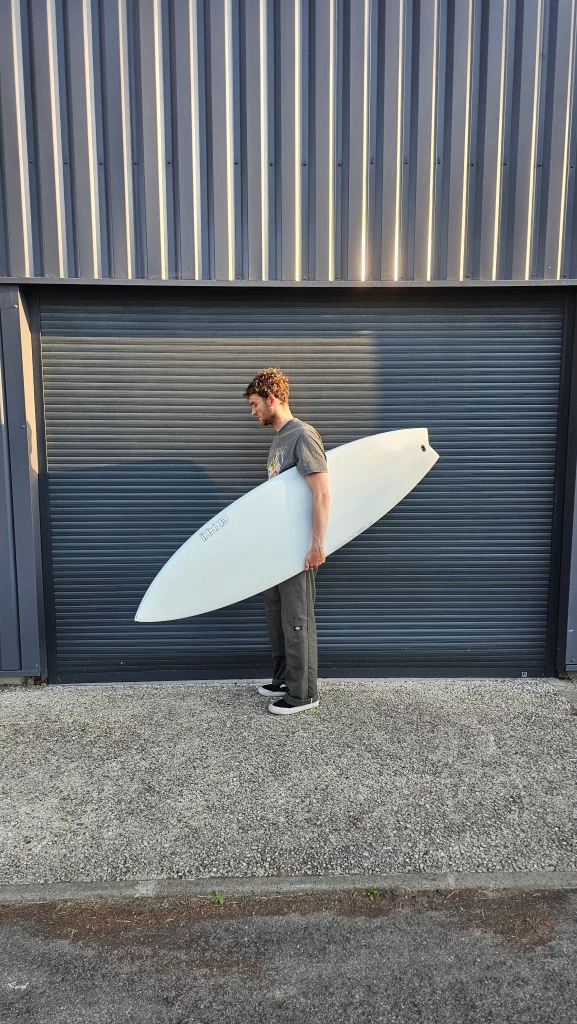 Ekahi Channels carbon surfboard, white deck, top deck view