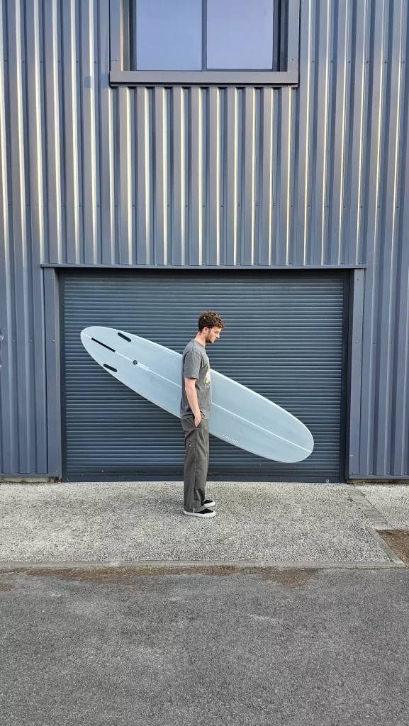 Ekahi Long carbon surfboard, grey deck, bottom view