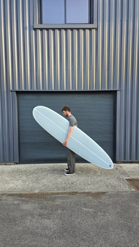 Ekahi Long carbon surfboard, grey deck, top deck view