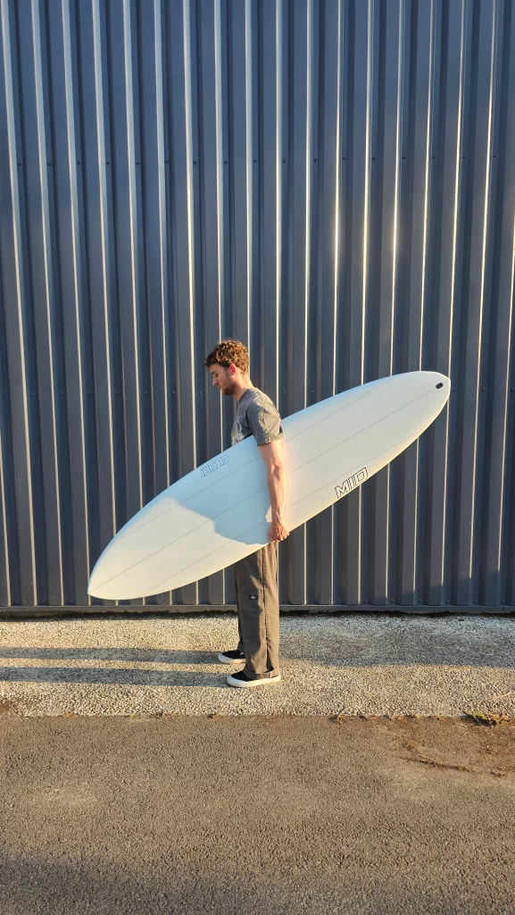 Ekahi Mid carbon surfboard, white deck, top deck view